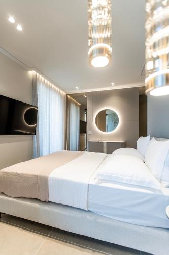 a bedroom with a large white bed in a room at Keslin Premium Seaside Apartments in Vlorë