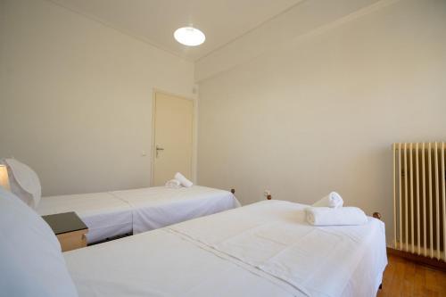Ένα ή περισσότερα κρεβάτια σε δωμάτιο στο Urban Nest In Chalandri by MΡS