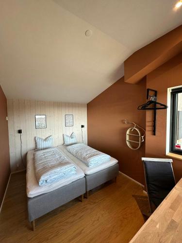 a bedroom with a bed in the corner of a room at Elevated House With Tremendous View Near Horsens in Odder