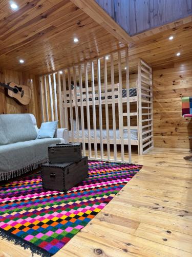 a living room with a couch and a rug at Calm, Comfort and Simplicity in Sens