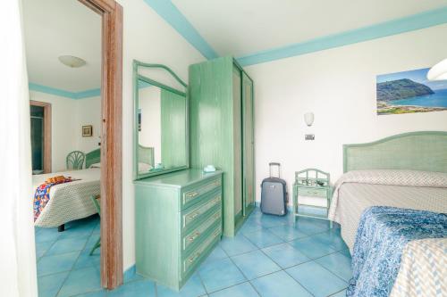 Кровать или кровати в номере Hotel Casa del Sole