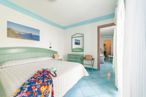 Кровать или кровати в номере Hotel Casa del Sole
