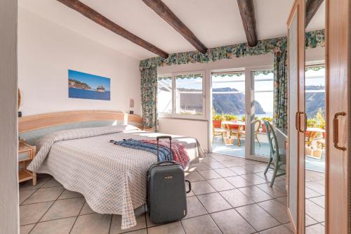 Postel nebo postele na pokoji v ubytování Hotel Casa del Sole