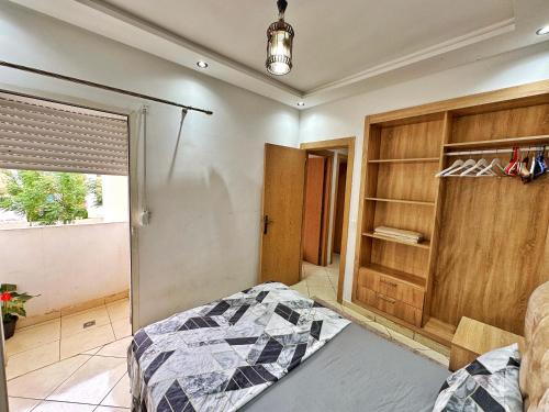 Una cama o camas en una habitación de Appart Charmant, Plage Skhirat
