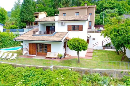 a villa with a view of a house at Miradouro 13 - Gerês in Geres
