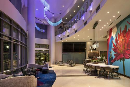 a lobby with a table and chairs in a building at Residence Inn by Marriott Los Angeles L.A. LIVE in Los Angeles