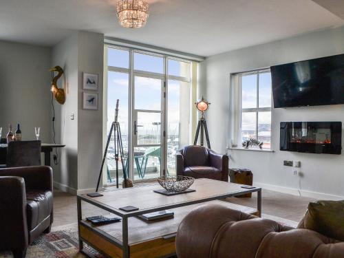 a living room with a couch and a table at Quayside7 in Whitehaven
