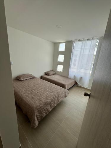 Ένα ή περισσότερα κρεβάτια σε δωμάτιο στο Cantabria casa Q6