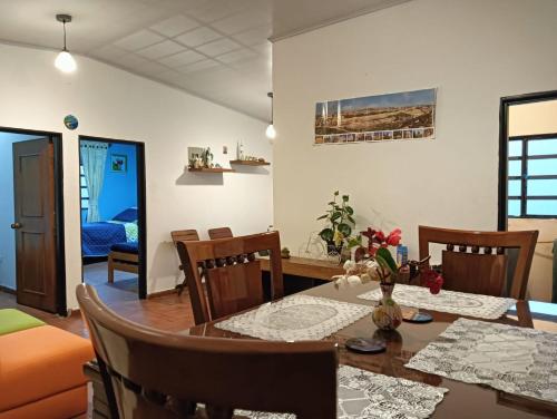 a dining room with a table and chairs at Villa Alegría in Choachí