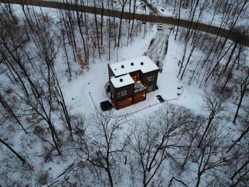 an aerial view of a house in the snow at Mountain View Retreat with Private Hot Tub & Pool in La Conception