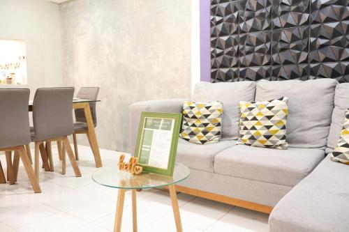 a living room with a couch and a table at Lolas house in Ciudad del Carmen