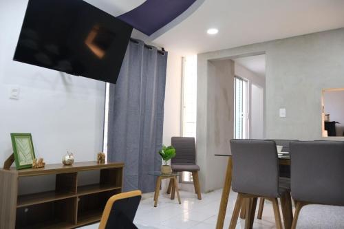 a dining room with a table and chairs at Lolas house in Ciudad del Carmen