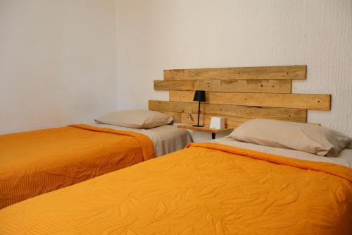 two beds sitting next to each other in a room at Lolas house in Ciudad del Carmen