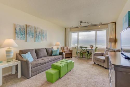 a living room with a couch and a table at Sea Gypsy Rentals - Oceanfront Suite in Lincoln City