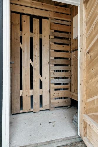 an open door to a room with wooden walls at Cabin With Panoramic Views Over Trysil in Trysil