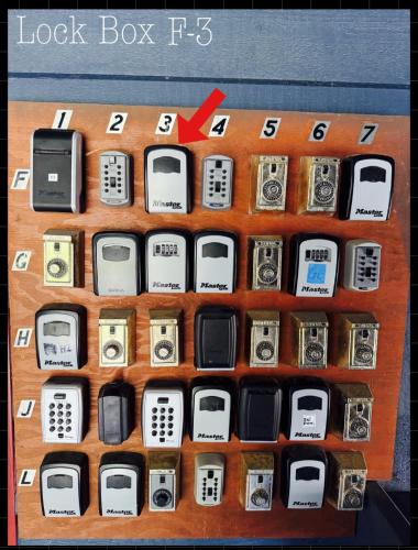a display of old cell phones on a shelf at Alyeska Mountain Side Retreat! in Girdwood