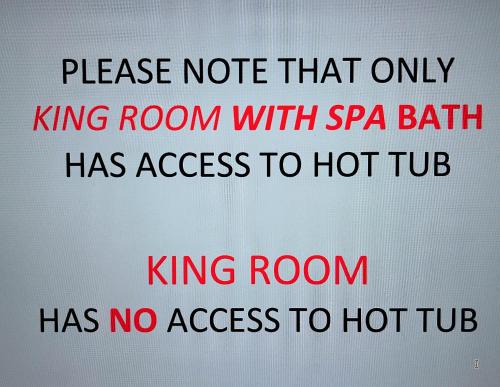 a sign with the words king room has no access to hot tub at Lake and the City Bed and Breakfast in West Kelowna