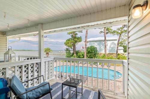 a balcony with a view of a swimming pool at Wolf Bay Villas in Orange Beach
