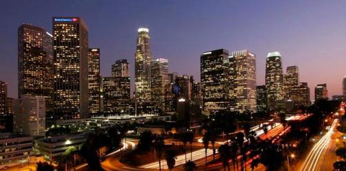 a view of a city at night with buildings at Value Inn in Sylmar