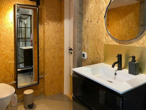 a bathroom with a sink and a mirror at House In Skæring Near City And Nature in Egå