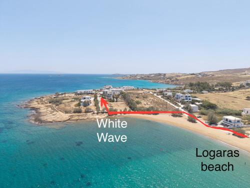 an aerial view of a beach with the words white wave and leynes beach at White Wave in Logaras