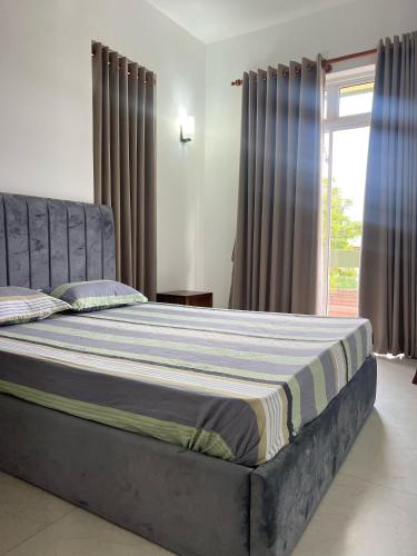 Cama o camas de una habitación en EZ Colombo Comfort