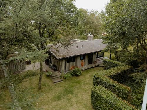 an aerial view of a house with a yard at Warm 70S Vibe Near Limfjord in Løgstør