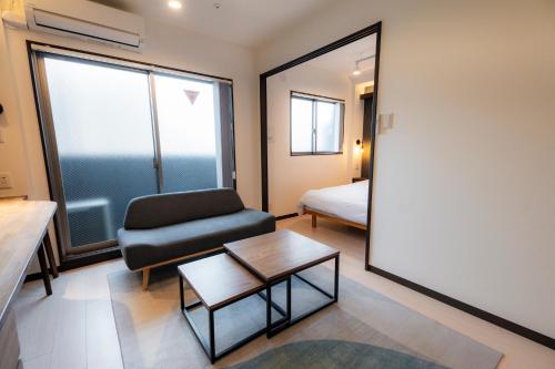 Ένα ή περισσότερα κρεβάτια σε δωμάτιο στο Apartment Hotel MODISH Gion