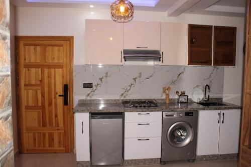 Η κουζίνα ή μικρή κουζίνα στο tourist apartments