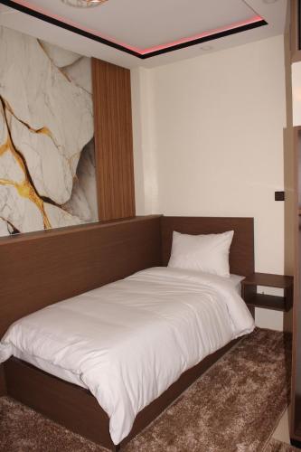 Ένα ή περισσότερα κρεβάτια σε δωμάτιο στο tourist apartments