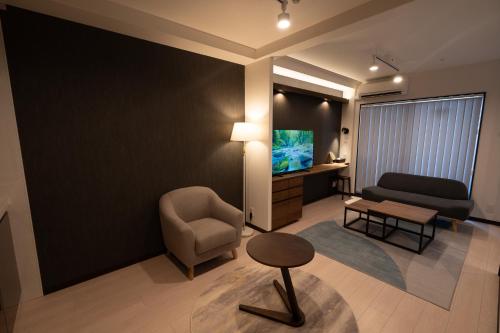 Μια τηλεόραση ή/και κέντρο ψυχαγωγίας στο Apartment Hotel MODISH Gion