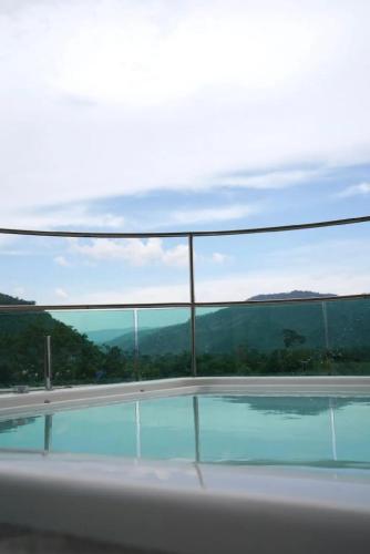 a view of a swimming pool from the balcony of a house at Viewpoint Khaoyai Hotel in Mu Si