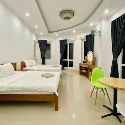 Postel nebo postele na pokoji v ubytování Phố Biển 3