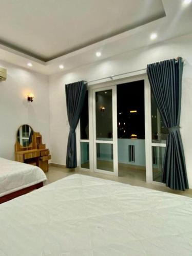 Postel nebo postele na pokoji v ubytování Phố Biển 3
