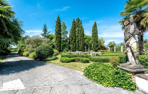 a statue of a woman in a garden at Ca' Dotta in Thiene