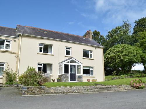 a large white house with a driveway at The Farmhouse - Uk13183 in Cwm-Morgan