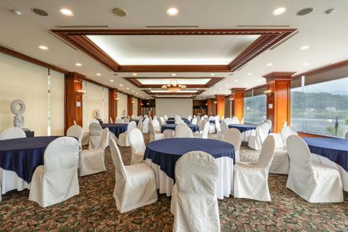 a banquet hall with blue and white tables and chairs at The Hill House Yangpyeong in Yangpyeong