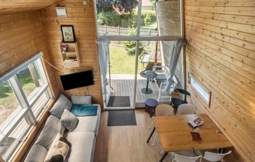 an overhead view of a living room in a tiny house at 1 Bedroom Cozy Home In Væggerløse in Bøtø By