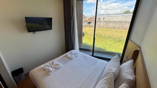 Katil atau katil-katil dalam bilik di The Fields Hotel and Apartment
