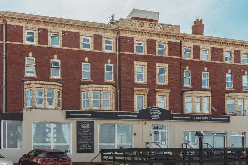 a brick building with a car parked in front of it at The Royal Boston Hotel by Compass Hospitality in Blackpool