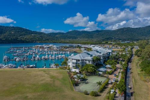 an aerial view of a marina with boats at Marina Living with views and more in Airlie Beach