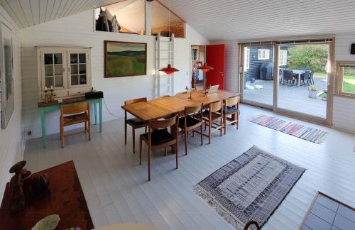 a dining room with a wooden table and chairs at Atmosphere And Space At The Home By Vig in Vig