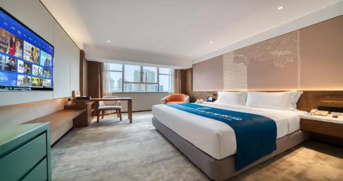 Postel nebo postele na pokoji v ubytování Sanyu Hotel