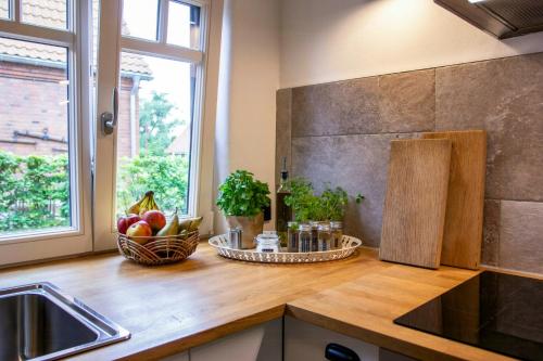 a kitchen counter with a bowl of fruit and a window at Oasis Of Peace Near The Lake in Langen Jarchow