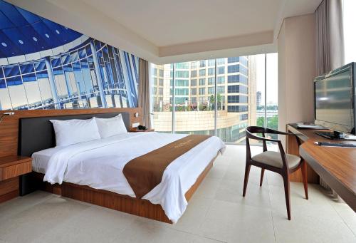 TV a/nebo společenská místnost v ubytování Midtown Hotel Surabaya