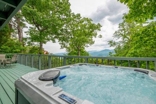 a hot tub on the deck of a house at A Bears View in Gatlinburg