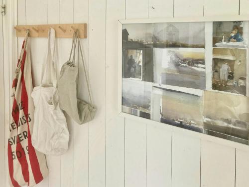 a room with two bags hanging on a wall at Farmhouse In Bohuslän Near Sea And Nature in Hamburgsund