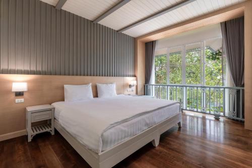 Postel nebo postele na pokoji v ubytování Na Sook Wellness Resort