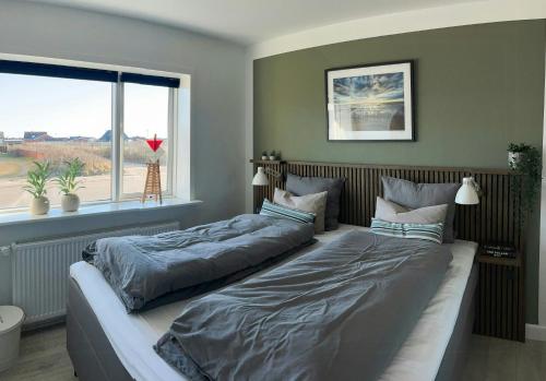 Postel nebo postele na pokoji v ubytování Charming Town House In Thyborøn Near The North Sea