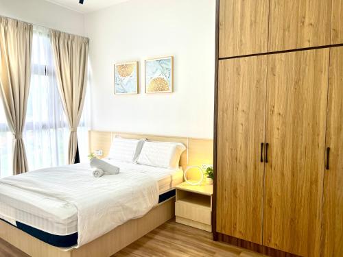 Postel nebo postele na pokoji v ubytování Ipoh Tambun Cove Luxe Premium Suites